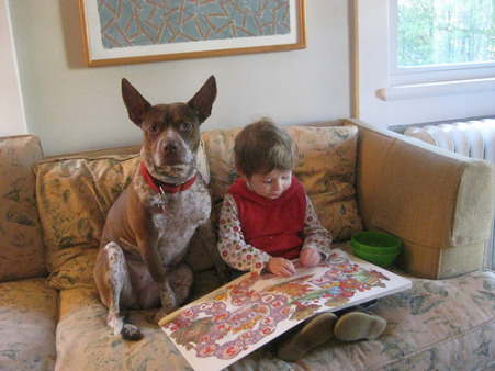boy reading to dog