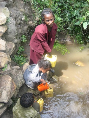 africa poverty girl collecting water
